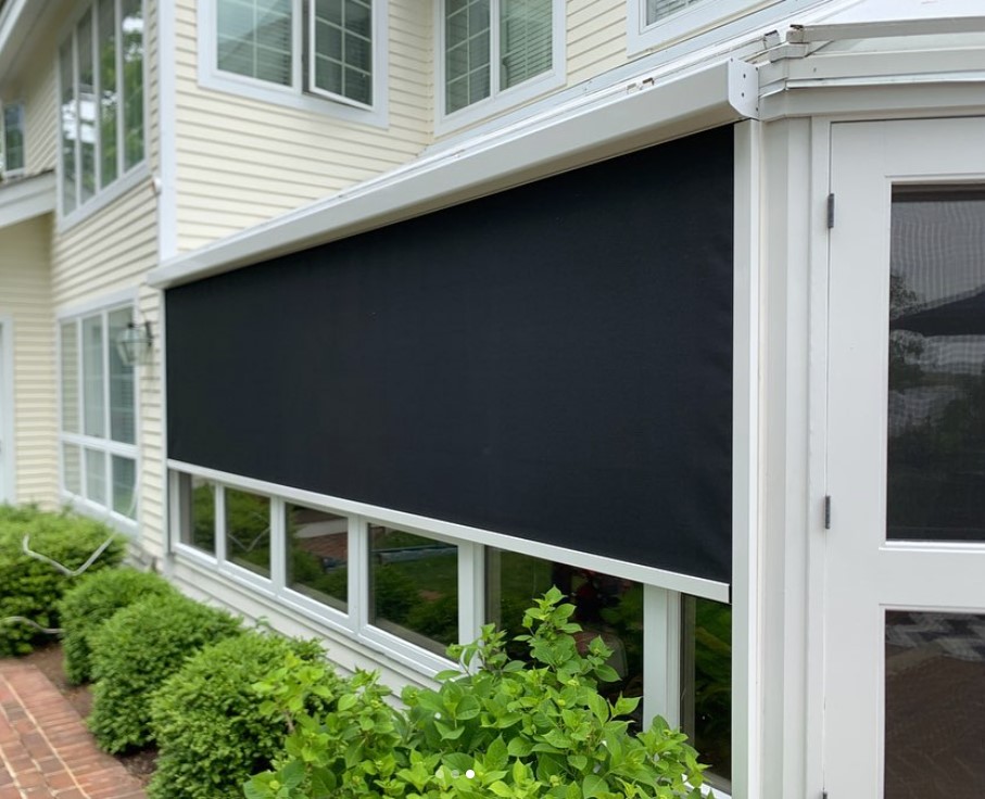 Eclipse E-Zip motorized exterior screen in a white frame