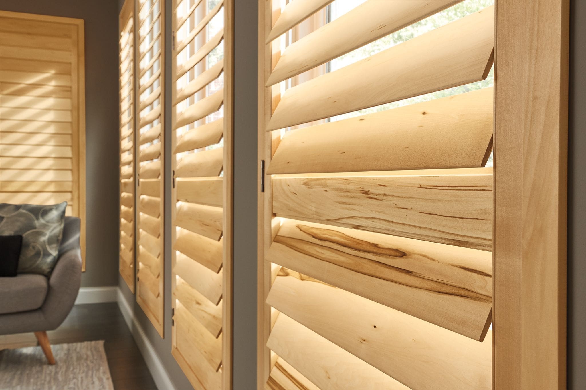 Close-up of natural wood plantation shutter louvers