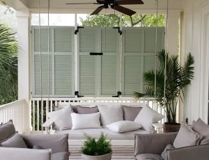 The Shutter House - pillows on a front porch swing