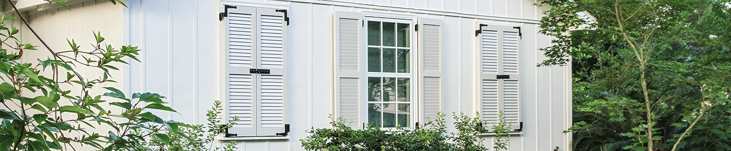 white house with white exterior shutters
